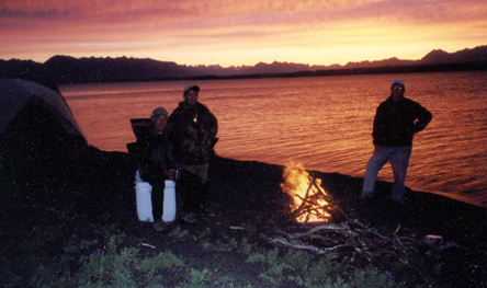 Sunset light across Alaska mountains and backcountry water